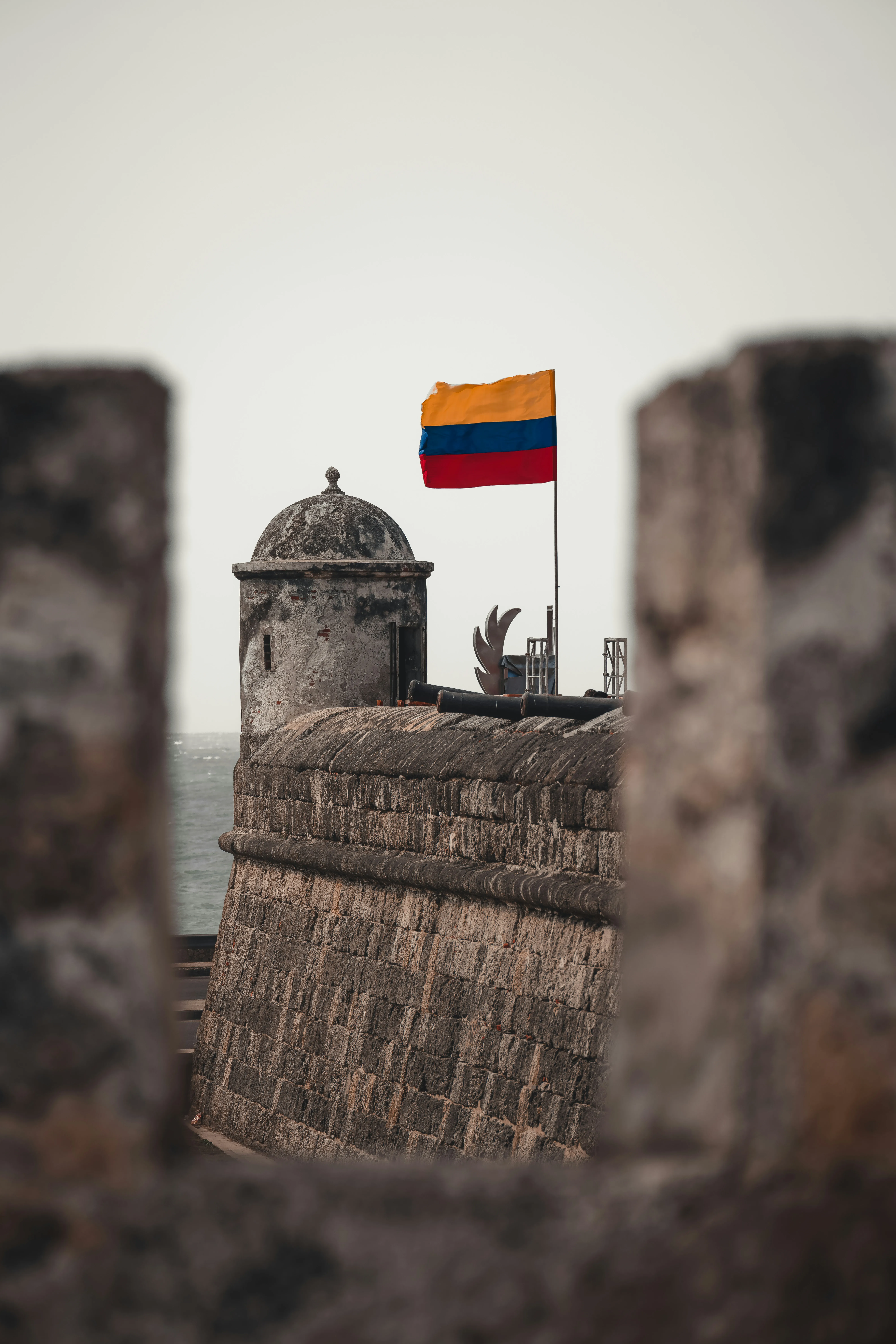 The sentry box of Castillo San Felipe de Barajas, flying the Colombian flag