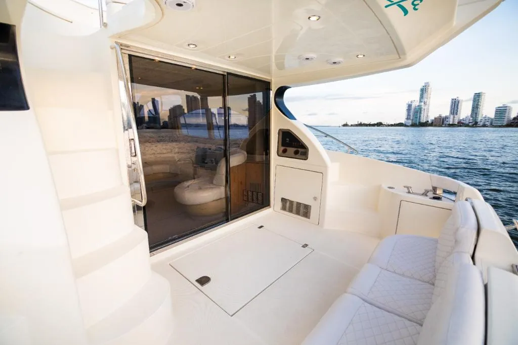The aft deck seating area with the city skyline in view